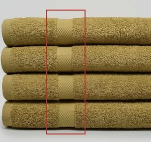 Most people spend their entire lives without ever knowing what the lines on a bath towel actually mean.