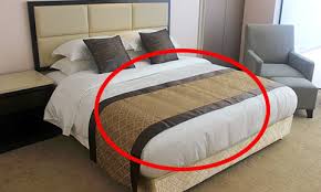 Why Do Hotels Always Place a Cloth Across the Bed? The Surprising Purpose Explained
